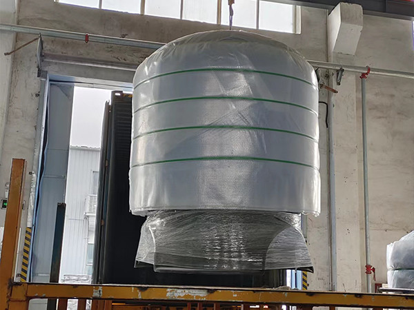 A device is loading FRP tanks into container.
