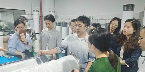 Technicians are explaining the UF membrane production process to the sales team.