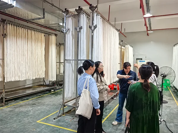 The staff is explaining the MBR membrane production process to the sales team.