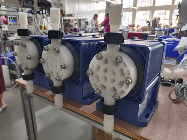 Various models of metering pumps arranged in the production workshop