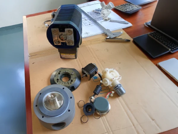 Snowate metering pump and its various components arranged on a desktop