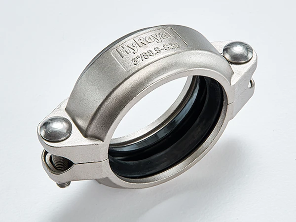 A piece of S30 stainless steel flexible grooved coupling on white background.