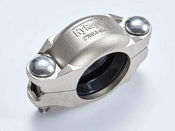 A piece of S80 stainless steel flexible grooved coupling on white background