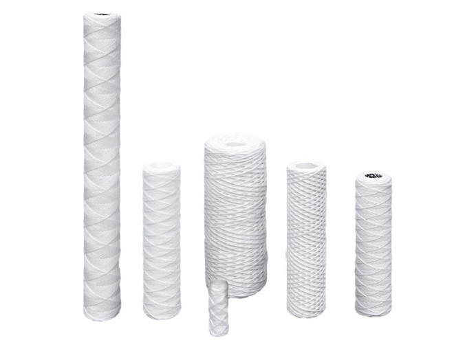 Three pieces of string wound filter cartridges.