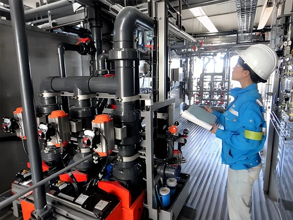 The worker is checking the operation of the thermoplastic valve in the equipment.