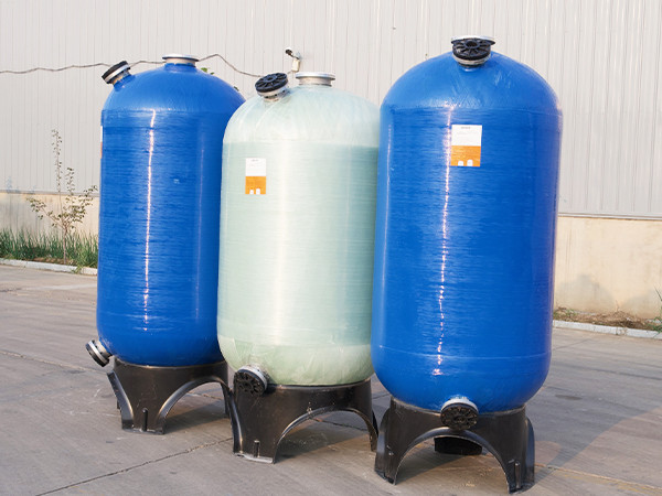 Three FRP tanks with upper loading and lower discharge port.